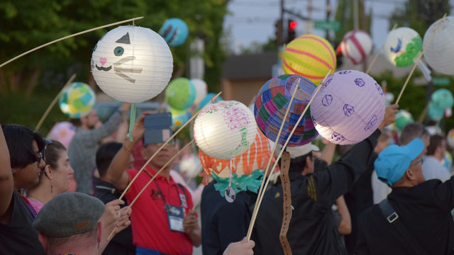 Lanterns are held at a climate change vigil
