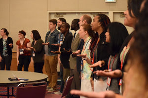 Young Adults gather in a circle