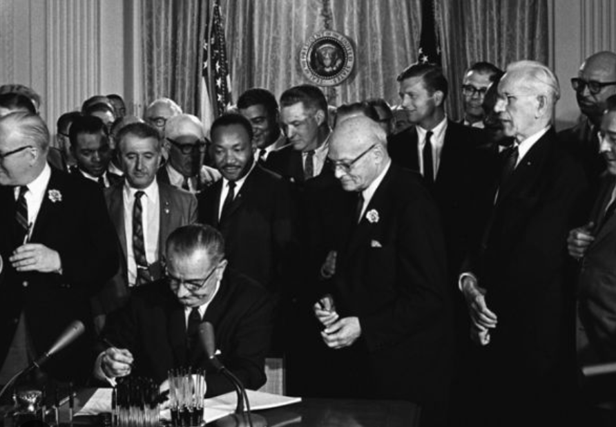 LBJ signing civil rights act