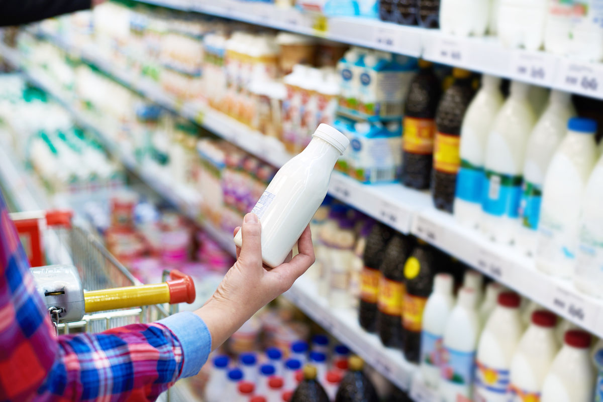 A woman shops for milk