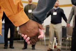 People holding hands in circle