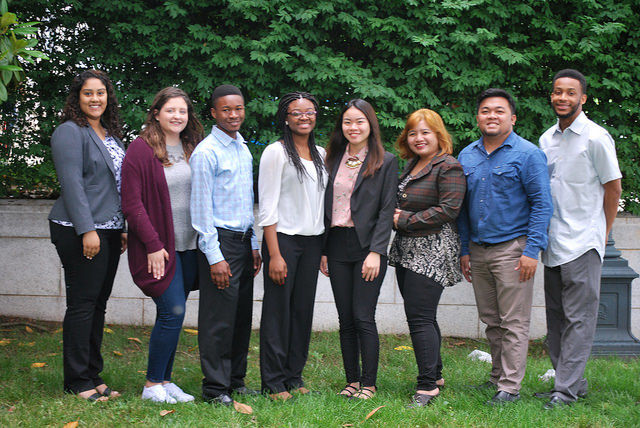Eight ethnic young adult interns. 