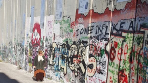 Janet Lahr Lewis by Separation Wall in Bethlehem