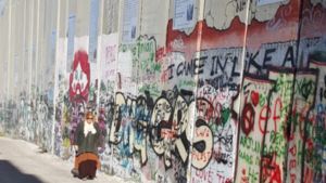 Janet Lahr Lewis by Separation Wall in Bethlehem 
