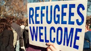 Sign reads "refugees welcome"