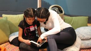 Children read at the San Fernando Valley Refugee Children Center