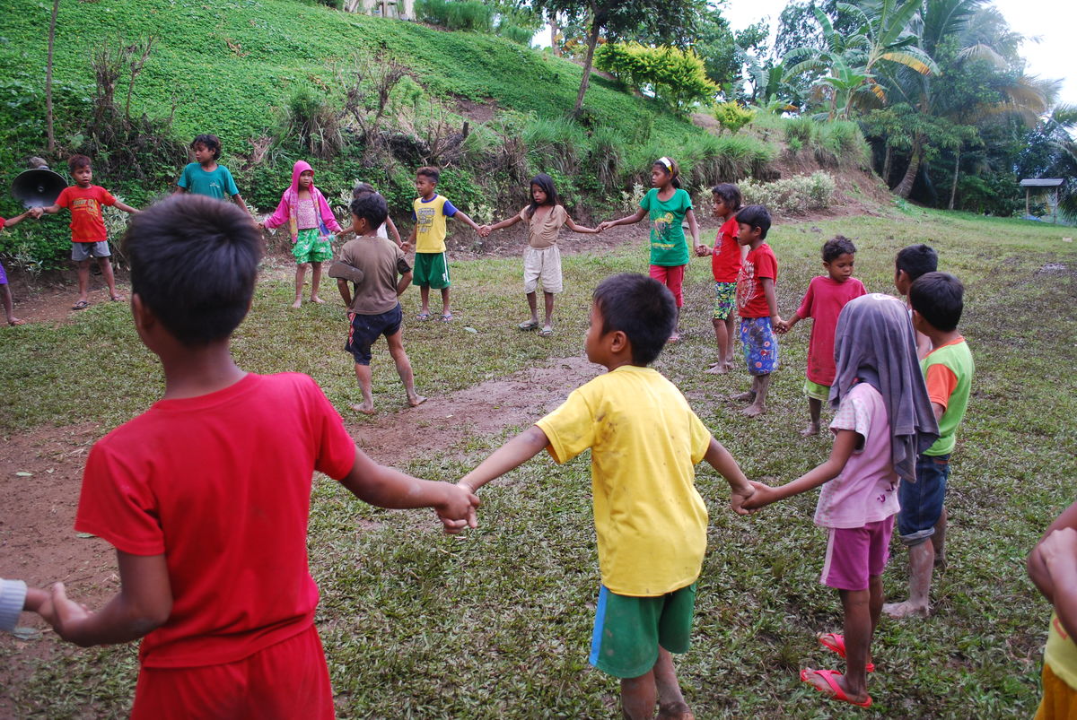 Children from the Philippines hold hands