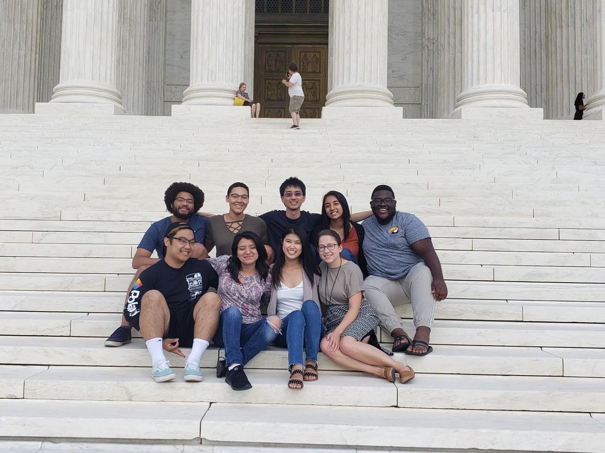 EYA interns pose for a group picture on the steps of the Supreme Court Building.