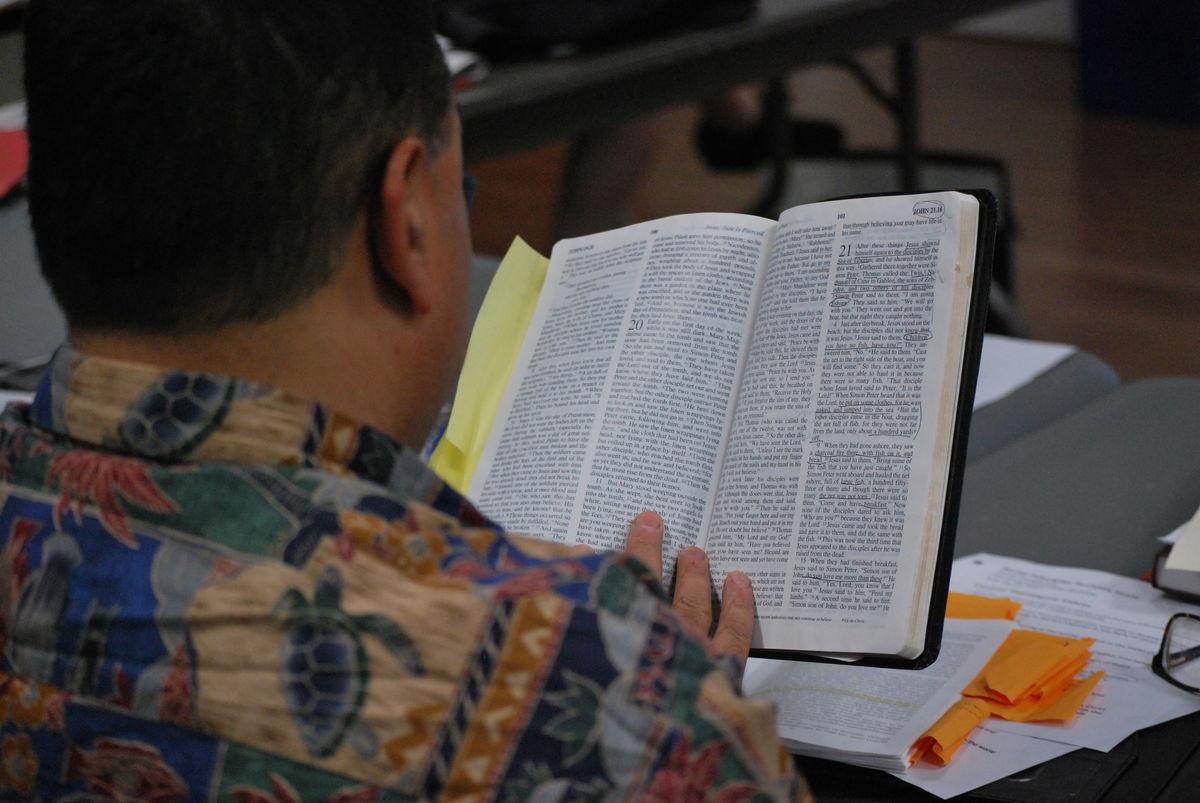 Image of person reading revising SP and reading bible