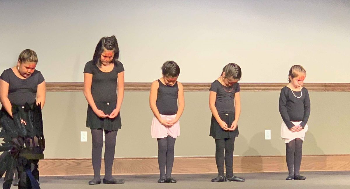 Numunu Nahmi Oklahoma Ballet Performers. A red handprint, as seen on the faces of these performers, symbolizes the voice of missing and murdered indigenous women silenced.