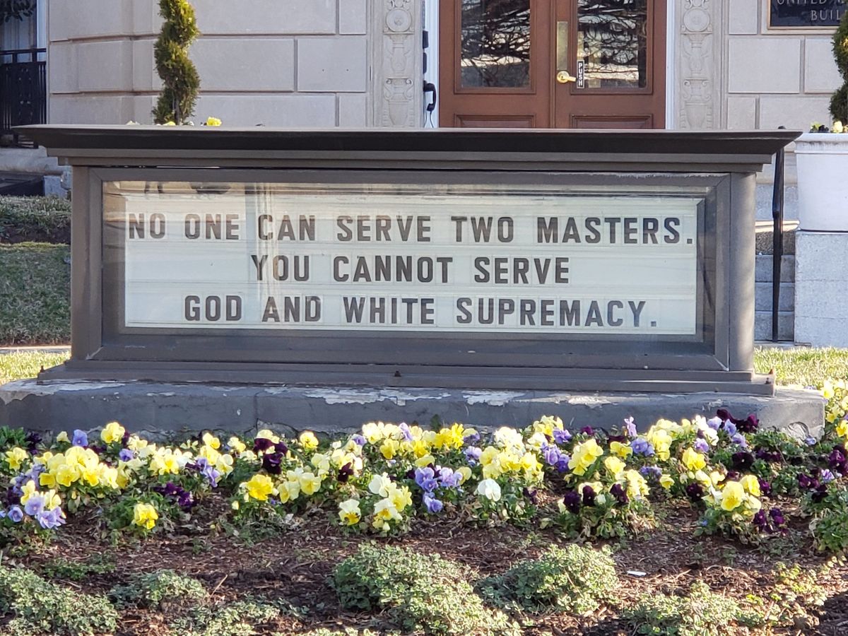 UM building sign - no man can serve two masters. you cannot serve white supremacy and god