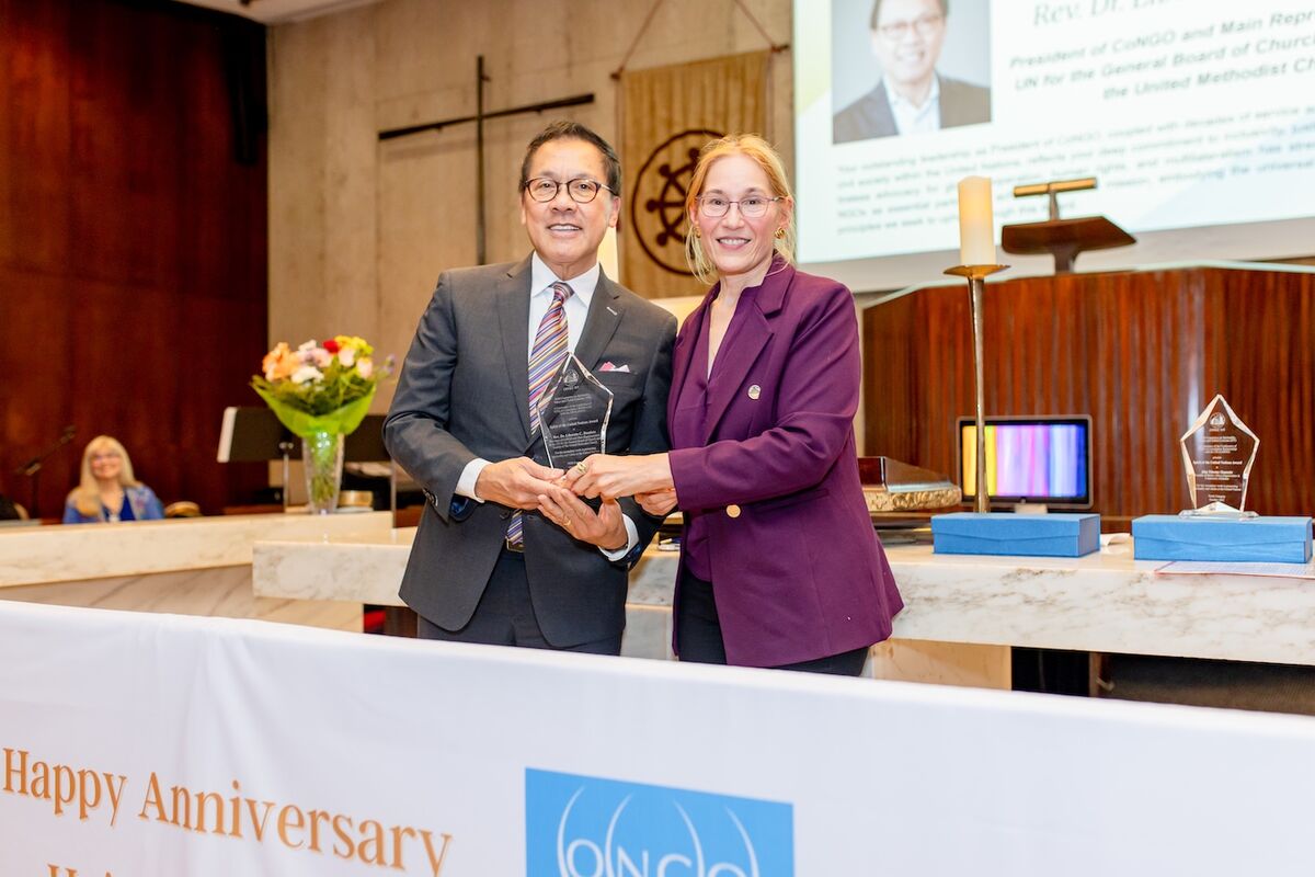 Rev. Denise Scotto, Esq. (right), presents The Rev. Liberato Bautista (left) with the Spirit of the United Nations Award.