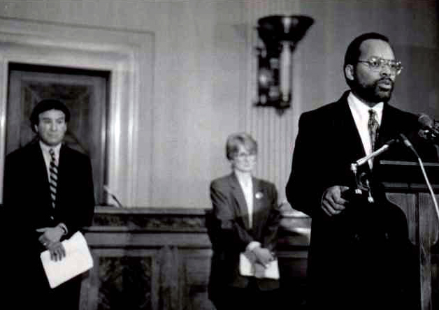 Mark Harrison speaks during a campaign finance reform event on Capitol Hill in March 1994. Harrison, who retired Nov. 30, 2021, built many relationships with Congressional leaders and their staffs as an advocate for peace and justice.