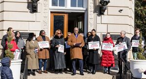 People gather at the United Methodist Building for a prayer vigil
