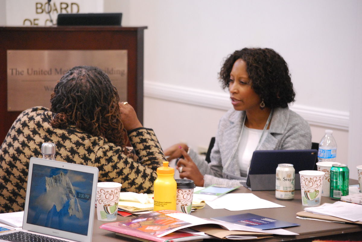 Two people engage in conversation.